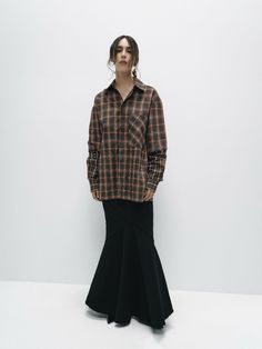 This oversized cotton shirt features a classic plaid pattern and button closures, offering a relaxed, comfortable fit. The design is elevated by contrasting sleeves, adding a modern twist to the traditional checkered style. The double-layered construction enhances the shirt’s structure and durability, making it a versatile piece for layering or wearing on its own. Combining timeless plaid with contemporary details, this shirt is perfect for adding a touch of effortless style to any outfit. Fabric: 80% CO, 20% PE Gender: UNISEX Made in UkraineModels parameters: Height 173 cm / Bust 85 cm / waist 60 cm / Hips 89 cm WOMEN XS S M L XL bust 80-84 85-89 90-94 95-99 100-104 waist 60-64 65-69 70-74 75-79 80-84 hips 82-86 87-91 92-96 97-101 102-106 MEN XS S M L XL bust 85-88 89-92 93-95 96-99 100-1 Checkered Shirt Outfit Women, Oversized Button Up Shirt Outfit, Checkered Shirt Outfit, Checkered Shirt, Plaid Pattern, Shirt Outfit, Capsule Wardrobe, Effortless Style, Cotton Shirt