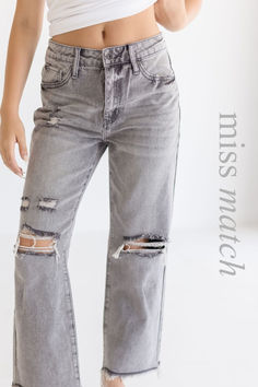 Fall in love with the Coraline High Rise Jeans! Featuring a five pocket design, distressed accents, button closure, and a charmingly frayed hem in a grey wash. Complete the look with boots and your go-to top for an effortlessly chic outfit! Distressed Gray Jeans For Spring, Ripped Gray Jeans For Fall, Gray Ripped Jeans For Fall, Trendy Gray Distressed Jeans, Gray Distressed Jeans For Fall, Gray Washed Jeans For Fall, Gray Jeans With Frayed Hem For Spring, Gray Frayed Hem Jeans For Fall, Gray Frayed Hem Jeans For Spring