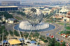 an aerial view of a city with fountains