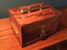 a wooden box sitting on top of a table with lights in the middle of it