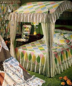 an image of a bedroom setting with four poster bed and quilted bedspread