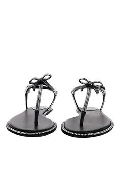 Refined in its simplicity, this black thong sandal effortlessly complements any outfit. Its minimal silhouette is embellished with a bow covered in tonal crystals, which give a romantic and feminine touch to even the most casual looks. Satin, leather Buckle fastening Hand-applied rhinestones Heel height 0.4” Made in Italy High End Shoes, Anna Dello Russo, Rhinestone Heels, Bow Flats, Footwear Design Women, Sandals For Sale, Leather Buckle, Black Crystals, Thong Sandals