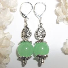 This Adorable Beaded Earring Set Is Brand New & Handmade By Me - Wvluckygirl. Done With Faux Light Jade Green Glass Beads. They Have Antiqued Silver Toned Costume Jewelry Beads. The Pair Dangle & Drop From 925 Sterling Silver Lever Backs For Women's Pierced Ears. Measure 2 Inches Tall & 1/2 Inch Wide. Each Single Earring Weighs 4.7 Grams. You Will Love The Ornate Detail Work On Those Beads. Very Eye Catching And Pretty. Buy Them Before Someone Else Does! Fashion Accessory Rustic Detailed Dangly Elegant Jade Beaded Earrings, Elegant Beaded Jade Earrings, Elegant Green Hypoallergenic Beaded Earrings, Elegant Jade Beaded Earrings With Round Beads, Elegant Jade Beaded Round Earrings, Silver Hypoallergenic Beaded Earrings, Elegant Silver Beaded Hypoallergenic Earrings, Mauve Earrings, Blue Pearl Earrings