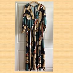 Oc Order Plus Long Sleeve Maxi Dress Size Small. New With Tags Geometric/ 70's/Boho Print Soft, Lightweight Syntheic Material. No Tag, But Feels Like A Poly/Rayon. Colors In Dress: Rust, Darker Creamy Yellow, Peacock Green, Creamy White V Neck 59.5" From Top Of Shoulder To Front Bottom Hem 23" Sleeves 34" Bust * There Is A Separation Near The Bottom At The Seam On The Left Side Of The Dress (See Photos). I Believe It To Be Fixable By Someone Who Can Stitch/Sew. Repair Needs Reflected In Price. Yellow Printed Fall Dress, Yellow Maxi Dress For Fall, Vintage V-neck Maxi Dress For Day Out, Retro Multicolor Printed Maxi Dress, Vintage Beach Maxi Dress For Fall, Vintage Fall Beach Maxi Dress, Fall Beach Vintage Maxi Dress, Yellow Flowy Long Sleeve Maxi Dress, Fall Beach Maxi Dress In Yellow