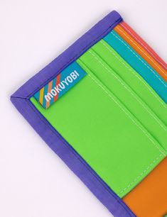 This rad wallet is the perfect place to keep all of your money related objects! Features 6 front-facing credit card slots with 2 extra hidden slots, a main cash pocket, color block detailing, and nylon binding. Shop all WalletsShop all Dragonfly Measures 9" wide x 4" tall unfolded, 4.5" wide folded.Water resistant 100% Coated Nylon Made in Los Angeles, California Everyday Multicolor Bifold Wallet, Modern Multicolor Wallets For Everyday Use, Bifold Multicolor Card Holder For Daily Use, Multicolor Bifold Card Holder, Modern Multicolor Rectangular Wallets, Green Rfid Blocking Trifold Wallet For Travel, Everyday Multicolor Rectangular Wallets, Rectangular Multicolor Wallets, Multicolor Bifold Wallet For Travel