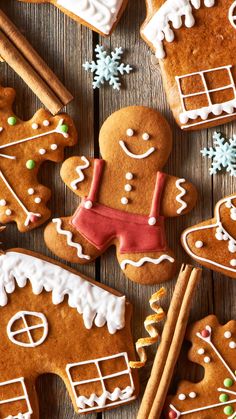 gingerbread cookies with icing and decorations on a wooden table