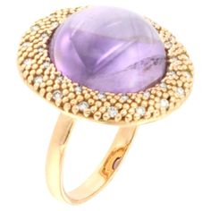 Modern and fantastic ring in rose 18kt gold Don't you love the cocktail rings? We love them very much, we love the colour . Gorgeous modern ring with special purple cabochon cut amethyst made in Italy by Stanoppi Jewellery since 1948. g. 8,30 size 16 - 56 Purple cabochon Amethyst round cabochon cut mm 14,00 white Diamonds cts 0.28 All Stanoppi Jewelry is new and has never been previously owned or worn. Each item will arrive at your door beautifully gift wrapped in Stanoppi boxes, put inside an elegant pouch or jewel box. Luxury Cabochon Amethyst Engagement Ring, Luxury Hallmarked Amethyst Oval Cabochon Ring, Elegant Pouch, Diamonds Ring, Modern Ring, Jewel Box, Amethyst Stone, White Diamonds, Purple Gold