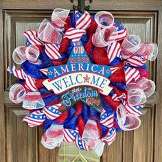 a patriotic welcome wreath hanging on the front door