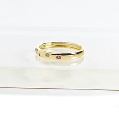 You can’t go wrong with this graceful and classic choice. Rainbow is a symbol of following your heart’s desire. Featuring with inset CZ rainbow stones, this dainty, lovely, and stackable ring can be worn alone or paired with all of your favorite Balara Jewelry rings!- Stones Material: Multicolor Cubic Zirconias.- Stones Shape: Round.- Metal: 925 Sterling Silver.- Plating: 14k Gold Plated.Ships in a Balara Gift Pouch.Available in Gold (sizes 5, 5 1/2 and 6 1/2). SKU# R1639 Promise Stackable Open Rings, Anniversary Stackable Open Band Midi Rings, Stackable Open Band Midi Rings For Anniversary, Elegant Adjustable Rainbow Rings, Dainty Stackable Open Birthstone Ring, Stackable Eternity Band For Promise, Classic Stackable Birthstone Ring For Promise, Classic Stackable Birthstone Promise Ring, Dainty Half Eternity Stackable Promise Rings