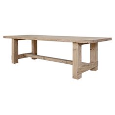 a large wooden table sitting on top of a white floor