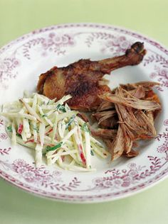 a white plate topped with meat and cole slaw