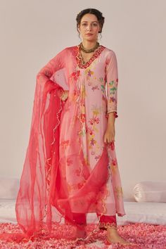 Pink crepe kurta with floral print and beads, zari and cutdana hand embroidered neckline. Comes with pant and a dupatta.
Components: 3
Pattern: Printed, Hand embroidered
Type Of Work: Floral, Beads, Zari, Cutdana
Neckline: V Neck
Sleeve Type: Three quarter
Fabric: Crepe
Color: Pink
Other Details: 
Tasseled detailing on kurta
Attached lining
Product Weight : 1 Kg
Occasion: Sangeet - Aza Fashions Kurta Pant Set, Embroidered Neckline, Kurta With Pants, Pant Set, Set For Women, Aza Fashion, Sleeve Type, Three Quarter, Hand Embroidered