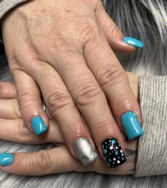 Make a bold statement with our glitter accent nails featuring a vibrant bright blue color! Pair it with a chic black nail adorned with dot nail art for a trendy and eye-catching look. Glitter Accent Nails, Bright Blue Color, Dot Nail Art, Dots Nails, Black Nail, Accent Nails, Black Nails, Bright Blue, Dots