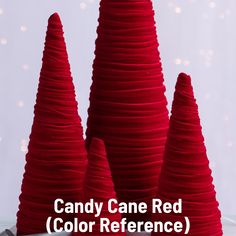 candy cane red color reference cones on a white surface with pink lights in the background