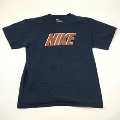 Nike shirt. Good used condition. Subtle spots on the front. See pictures for details. Check out my other items!   Your satisfaction is very important to us. If you have any questions at all message me anytime I will get back to you as soon as possible. Generally within one business day. Shop and follow our store for many other High-Quality items. New items added weekly. Lifestyle Supply Company CHECK OUT OUR VINTAGE CLOTHING! Vintage Nike Cotton Tops, Nike Retro Tops With Letter Print, Vintage Navy Cotton T-shirt, Vintage Cotton Top With Branding, Nike Navy T-shirt With Graphic Print, Nike Navy Tops With Letter Print, Nike Cotton Shirt With Letter Print, Nike Retro Short Sleeve Top, Nike Navy Tops For Streetwear