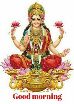 the hindu goddess sitting on lotuses with her hands up in front of her face