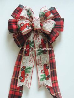 a red and black plaid ribbon with christmas decorations on it