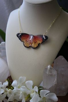 This handmade jewelry collection combines the ethereal beauty of butterfly and moth specimens with the natural allure of genuine quartz. Each piece is meticulously handcrafted with high-quality mica coated prints of these delicate creatures, capturing their intricate patterns and vibrant colors. The addition of quartz adds a touch of enchantment, reflecting the organic elements found in nature. Wear these creations as a symbol of your appreciation for nature's wonders and as a reflection of your Orange Butterfly-shaped Jewelry Gift, Orange Butterfly Jewelry For Gifts, Orange Butterfly Jewelry Gift, Bohemian Butterfly Necklace As A Gift, Bohemian Butterfly Necklace For Gifts, Monarch Butterfly Necklace, Butterfly And Moth, Crystal Wrap, Butterfly Necklace Gold