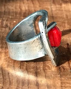 "This eye catching sculptural ring is kinetic in that the bright red square bead swivels! The shape reminds me of the old fashioned buckle ring. The face of this ring is 1\" at its longest. The red square bead is faceted. The ring is marked Anne Marie Chagnon (the mark is a bit faded). it is size 7 1/2 - 8. It is in very good vintage condition. Please see all photos for details, as well as, condition. Thank you for looking!" Hand Cast Modernist Jewelry For Gifts, Modernist Hand-cast Jewelry For Gifts, Modernist Hand Cast Jewelry As Gift, Modern Red Ring Jewelry, Modernist Handmade Rectangular Jewelry, Unique Red Metal Rings, Red Rectangular Adjustable Jewelry, Handmade Adjustable Brutalist Jewelry, Modern Handmade Red Ring