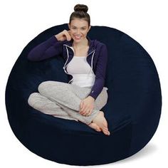 a woman sitting on a bean bag chair