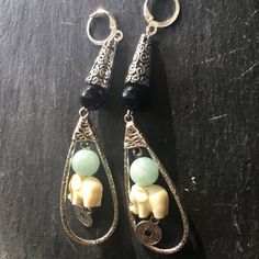 Elephants earrings decorated with jade and cairo night beads. SHIPPING  Shipping time within Europe is 1-10 bussiness day's . USA 10-24 days. You will get tracking number to follow it online. My other Etsy shop for stained glass,oil,pastel,watercolour or mix media paintings. https://www.etsy.com/shop/Raissaboutique  TO KEEP YOUR JEWELRY IN A GOOD CONDITION:  - please avoid contact with water or chemicals  - keep away from direct sunlight  - keep away from heat sources Each piece is handmade at m Handmade Spiritual Jade Earrings, Handmade Traditional Jade Earrings, Traditional Handmade Jade Earrings, Jade Beaded Dangle Earrings For Gift, Jade Earrings With Dangling Beads As A Gift, Elegant Jade Beaded Earrings, Beaded Jade Earrings As A Gift, Spiritual Jade Dangle Earrings, Elegant Beaded Jade Earrings