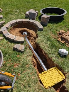 a hole in the ground that has been dug into with a shovel and other tools