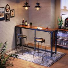 two stools are sitting at the bar in front of a wall with pictures on it