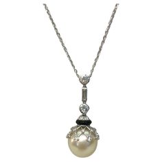 Vintage Italian 18 karat white gold necklace with a 15mm diameter pearl, onyx spacer, and diamonds for a total of 1.3 carats / Made in Italy 1930s-1940s 1940s Necklace, White Gold Necklace, Onyx Pendant, White Gold Necklaces, 3 Carat, Vintage Italian, White Gold Diamonds, Gold Diamond, Onyx