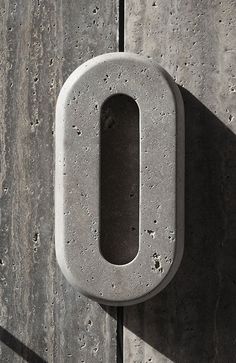 a concrete door handle on the side of a building