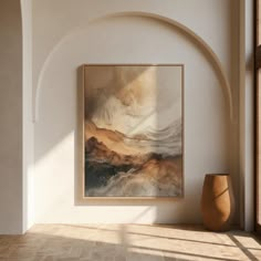 an abstract painting hangs on the wall next to a vase and window with sunlight streaming through it