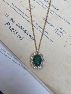 Gold-plated over brass vintage inspired pendant with crystals and a large oval emerald green measuring 2.4 cm 3 cm. Hung on a gold-plated over stainless steel twisted chain measuring 18 inches. Comes in a black velvet cushioned box as seen in last photo. Free of charge. INTERNATIONAL BUYERS please choose the tracking option if you would like your order to be tracked. FREE tracking upgrade with 3 items or more purchased. JEWELLERY CARE please don't wear plated jewellery in the shower, bath or swi Emerald Necklace Vintage, Luxury Oval Pendant Emerald Necklace, Vintage Emerald Pendant Necklace Gift, Vintage Emerald Pendant Necklace As Gift, Vintage Gold Emerald Necklace For Formal Occasions, Vintage Gold Crystal Necklace, Vintage Gold Plated Necklace With Oval Pendant, Vintage Gold Necklace With Emerald, Vintage Emerald Necklace As A Gift