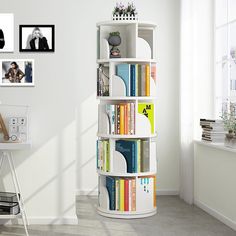 a white book shelf filled with lots of books