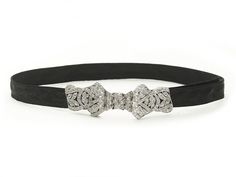 An Art Deco diamond set platinum bow choker, with an old-cut diamond set plaque, in the form of a bow, mounted in platinum, on a black moiré ribbon choker, with an estimated total diamond weight of 1.50ct, circa 1930. Period: Circa 1930 Style: Art Deco Metal: Platinum Stone: Diamond Approximate Measurements: Plaque 68mm, Choker 68cm Condition: Good - Wear consistent with age and use Approximate Weight: 14.2 grams Elegant Evening Jewelry With Black Ribbon, Formal Black Ribbon Choker Jewelry, Elegant Adjustable Jewelry With Black Ribbon, Black Ribbon Choker, 1930's Style, Bow Choker, Ribbon Choker, Diamond Choker, Retro Jewelry