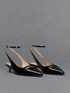 From the breezy open-back style to the sleek pointed toes, these leather pumps will get lots of wear in your wardrobe. Made out of supple calf leather, the black finish looks ultra-sophisticated while offering the great style mileage. As a subtly flirty detail, cut-outs on the vamps create a peek-a-boo effect that enhances its feminine appeal, especially when accompanied by dainty ankle-straps. Elevated on kitten heels that elongate the frame, these pumps will add a flattering finishing touch to your outfit. Black Pumps Heels, Kitten Heel Pumps, Charles Keith, Black Box, The Vamps, Peek A Boo, Ankle Straps, Leather Pumps, Making Out