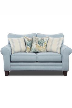 a blue couch with two pillows on it