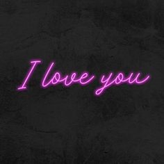 the word i love you is written in neon purple on a black background with dark spots