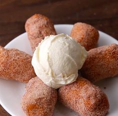 a white plate topped with donuts and ice cream