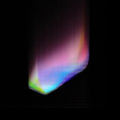 an image of a black background with multicolored lights in the dark space and on top of it is a square shaped object