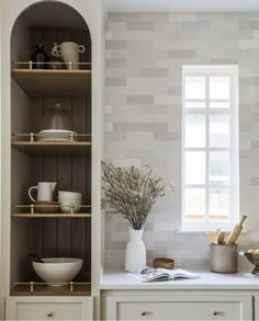 the kitchen is clean and ready to be used for cooking, baking, or eating