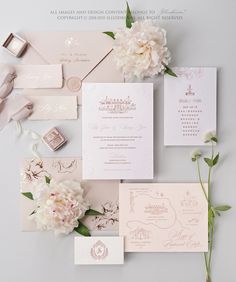 the wedding stationery is laid out on top of each other