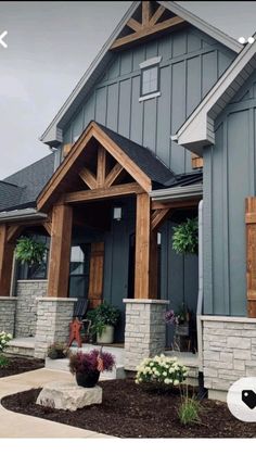 a house that has some plants in front of it