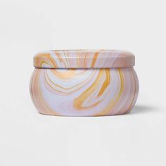 a marbled container with a lid on a white background