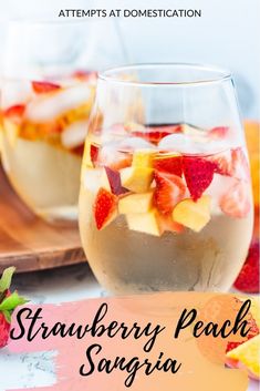 strawberry peach sangria in a glass with strawberries on the side and text overlay