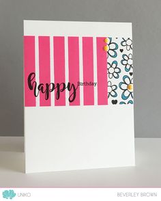 a happy birthday card with pink and white stripes on the front, black lettering that says happy birthday