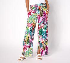 Dress like you're on vacation all season long in these splashy wide-leg pants fabricated from feel-good EcoVero. Generous hem slits keep the vibe breezy and your stride fluid. From Susan Graver. Trendy Wide Leg Pants For Vacation, Bohemian Bottoms With Tropical Print For Spring, Bohemian Tropical Print Bottoms For Spring, Summer Vacation Rayon Pants, Spring Wide Leg Beachwear Pants, Trendy Wide Leg Bottoms For Beach Season, Trendy Rayon Bottoms For Vacation, Multicolor Wide Leg Pants For Summer Loungewear, Multicolor Wide Leg Pants For Spring Vacation