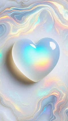 a heart shaped object sitting on top of a white and blue swirly wallpaper