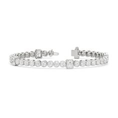 A sweeping sense of sophistication is deeply embedded within this tennis bracelet's timeless design. Bezel-set radiant and round diamonds line up to form a pattern, leading the eye from one flash of sparkle to another. Fastening the bracelet onto your wrist is a secure tongue-and-clip clasp. Radiant Bezel, Blue Wedding Band, Something Blue Wedding, Diamond Anniversary Rings, Mens Band, Something Blue, Style Gift, Tennis Bracelet, A Pattern