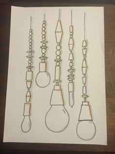 the drawing shows several different types of light bulbs hanging from hooks and wires on a piece of paper