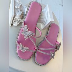 Pink Sandals With Butterflies And Rhinestones New In Box True To Size Spring Silver Sandals With Bling, Silver Bling Sandals For Spring, Silver Flat Sandals With Bling, Trendy Pink Sandals With Rhinestones, Silver Bedazzled Sandals For The Beach, Silver Flat Sandals With Rhinestones, Bedazzled Silver Sandals For The Beach, Silver Bedazzled Sandals For Beach, Spring Silver Bedazzled Sandals