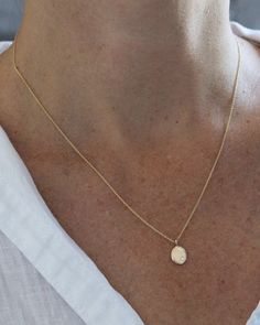 The sweetest, classic silhouette. This little recycled 14k gold droplet measures just about 3/8" by 1/4", and is accented with a tiny white diamond and hangs on a delicate cable chain. Available in 16", 18" or 20". Availability: Currently in stock and ready to ship. Dainty Yellow Gold Drop Necklace For Everyday, Minimalist Yellow Gold Round Pendant Drop Necklace, Minimalist Yellow Gold Teardrop Pendant Charm Necklace, Delicate Yellow Gold Drop Necklace For Everyday, Dainty 14k Gold Teardrop Pendant Necklace, Delicate Yellow Gold Teardrop Pendant Charm Necklace, Delicate Yellow Gold Teardrop Charm Necklace, Delicate Teardrop Yellow Gold Charm Necklace, Minimalist Oval Charm Necklace With Delicate Chain